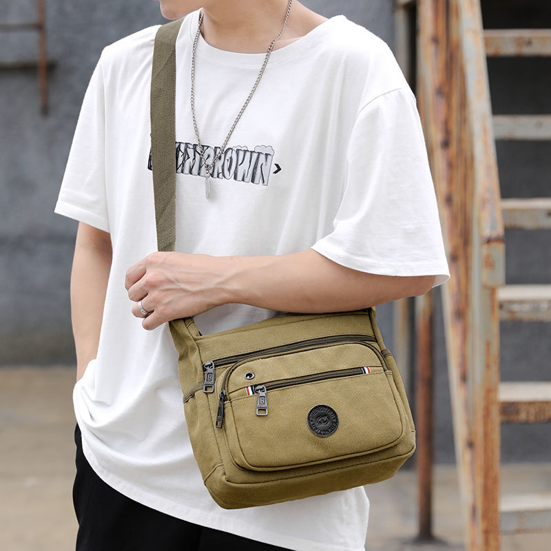 领头鸟帆布包男挎包休闲潮男士包包快递男包户外背包大容量斜挎单肩包