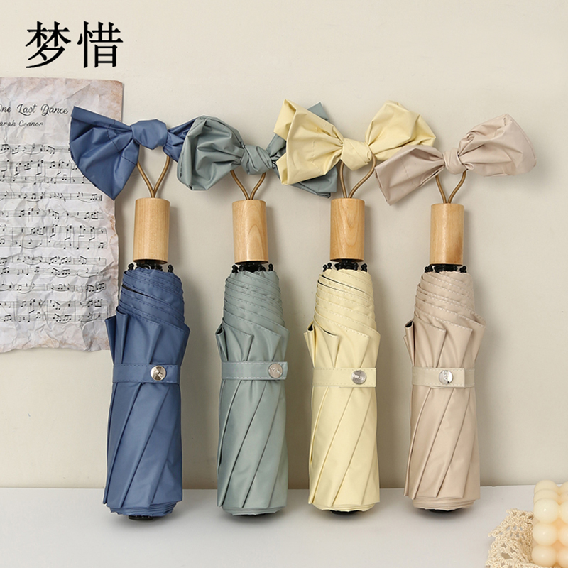 梦惜 手动钢骨玻纤 加厚黑胶布 实木手柄 晴雨两用伞 YF-S2021003/把高清大图