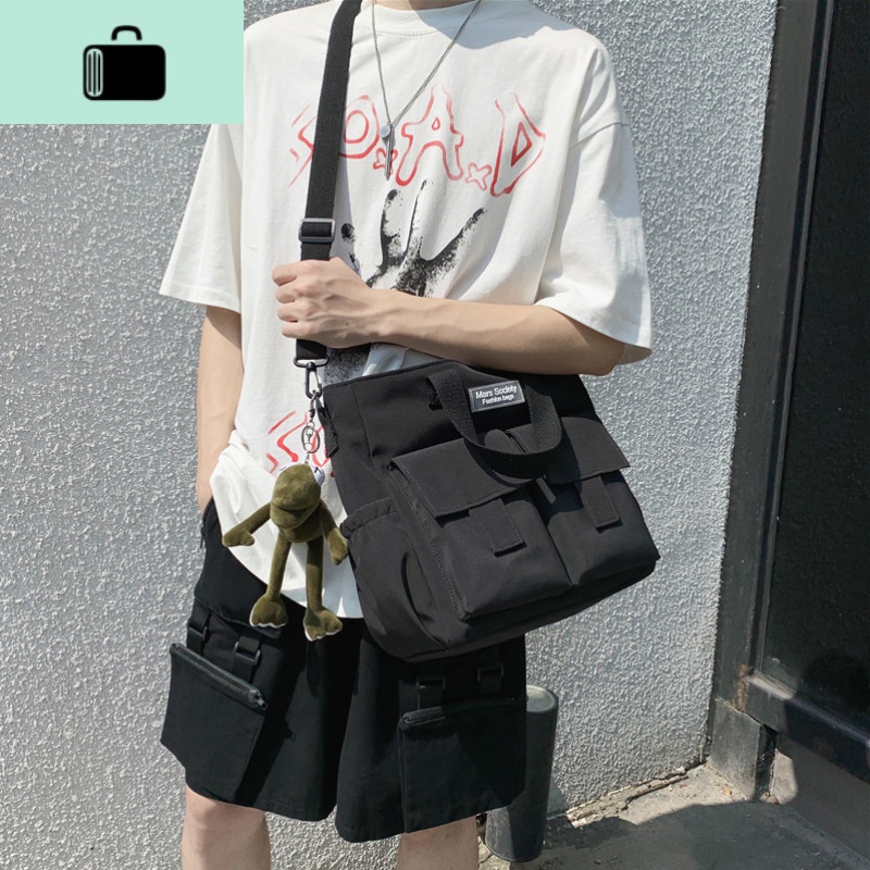 男士挎包休闲韩版潮牌学生日系单肩斜挎包简约帆布大容量邮差包女NEW LAKE男士斜挎包高清大图