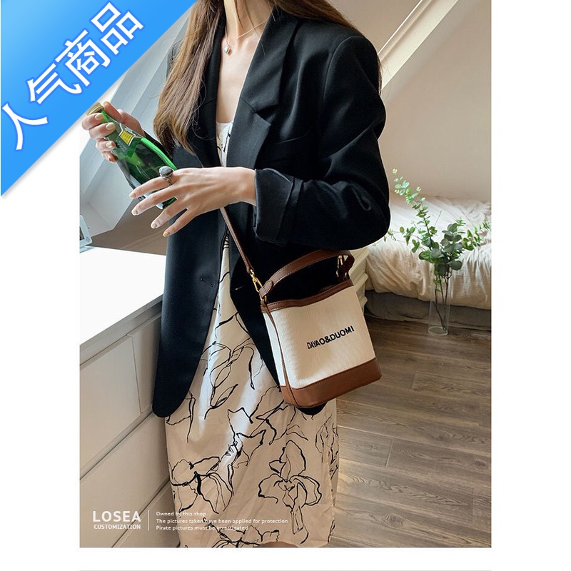 封后帆布水桶包包女夏季2022新款百搭感小众设计手提包斜挎托特包女包