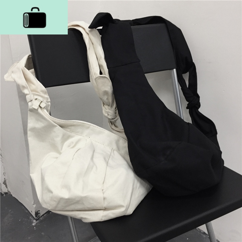 19ss韩国INS暗黑纯色系带打结学生百搭斜挎包帆布包饺子包男女款NEW LAKE女斜挎包
