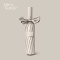 晴雨两用的伞 12骨全自动黑胶-杏色
