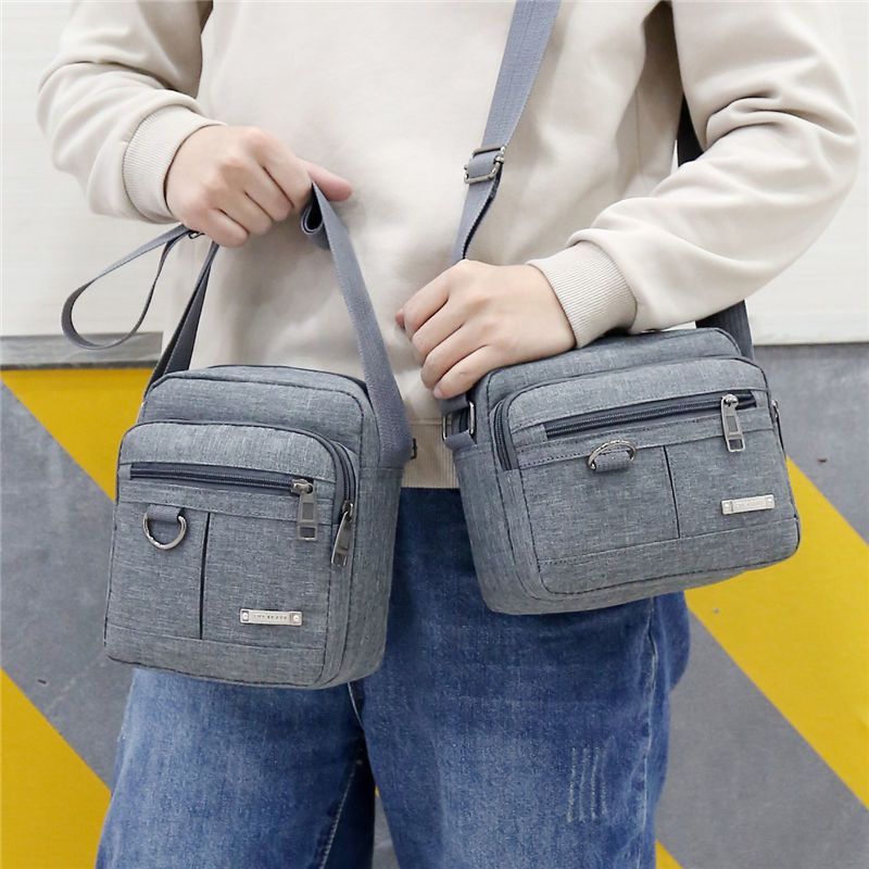 派尼美特男士牛津布单肩包斜跨休闲背包男商务小布包情侣款单肩布包男