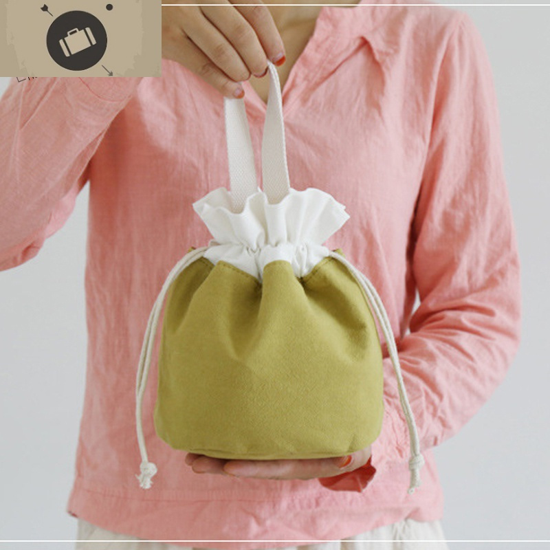 日系帆布手拎包女式抽绳束口袋简约纯色布艺小包水桶包手提化妆包艾狄