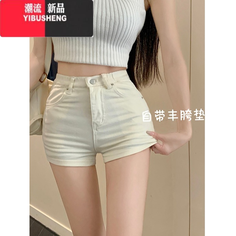 YIBUSHENG自带丰胯垫~韩版高腰牛仔短裤女季修身显瘦百搭辣妹包臀热裤潮 浅杏色自带丰胯垫 XS