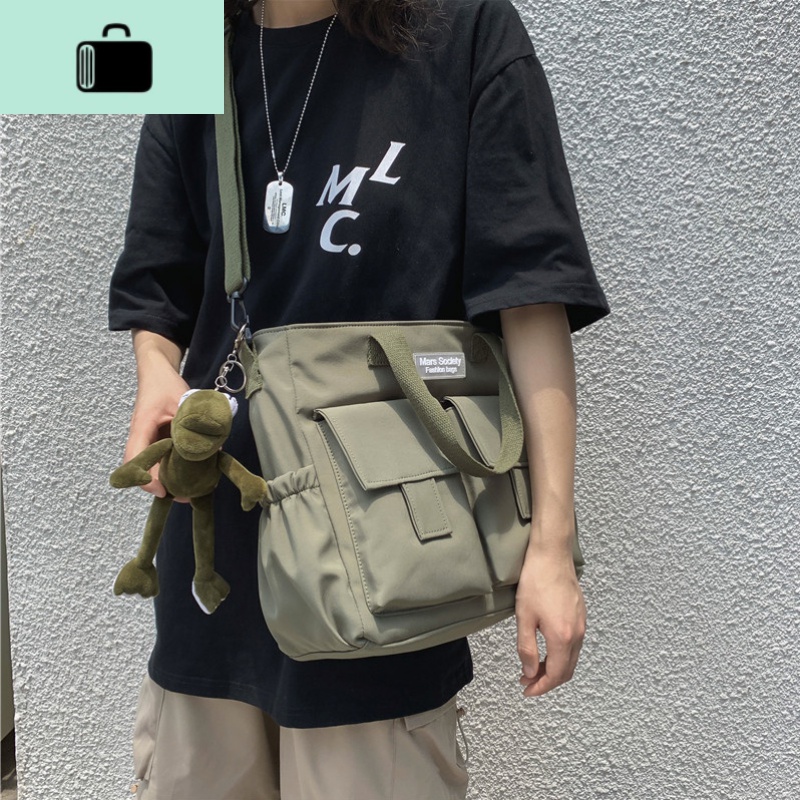 男士挎包休闲韩版潮牌学生日系单肩斜挎包简约帆布大容量邮差包女NEW LAKE男士斜挎包高清大图