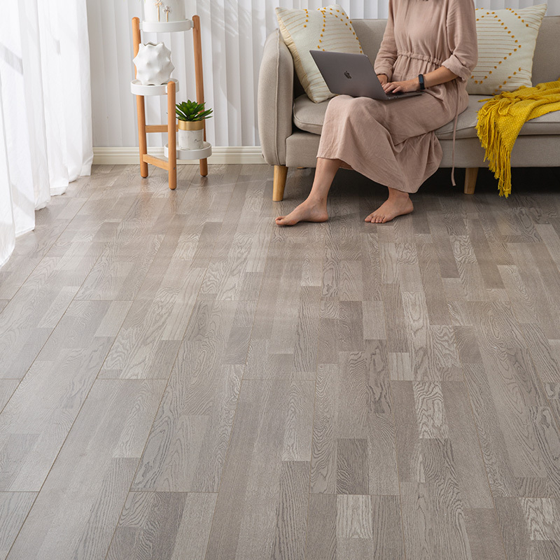 德尔地板环保强化复合木地板家用精绒磨砂耐磨防潮低光浅灰色客厅