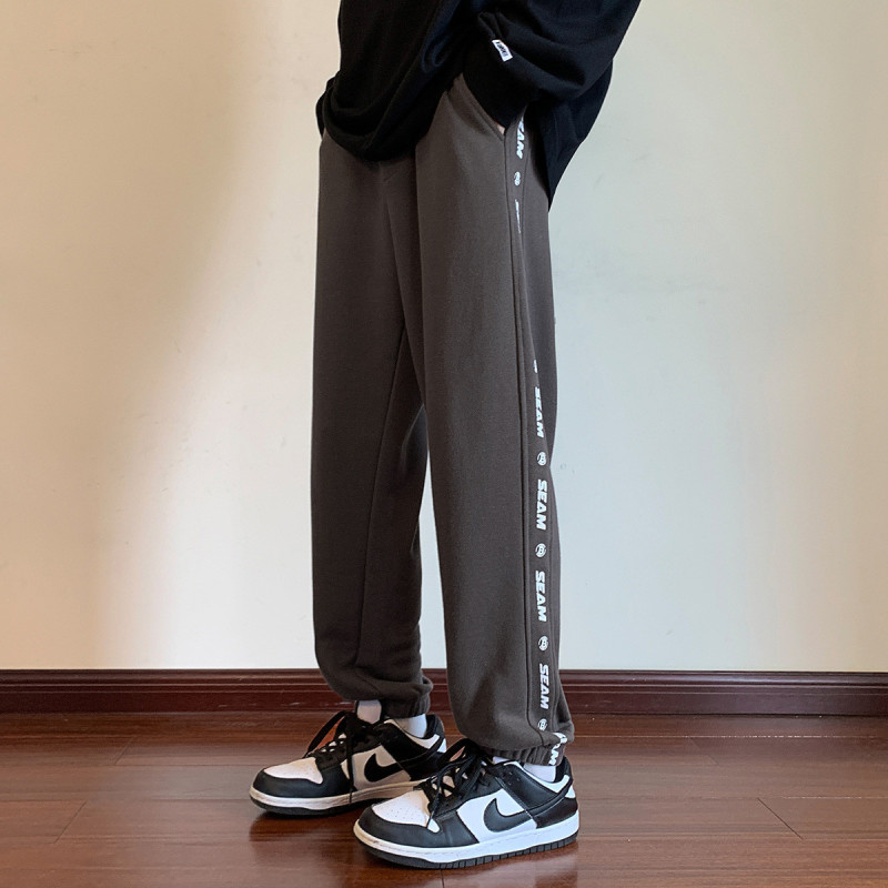 [1.5折价63元]唐狮 男针织串标印花新基本束腿休闲长裤
