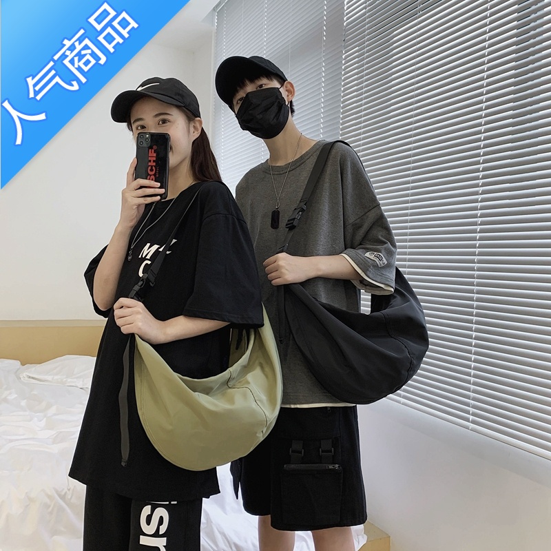 封后日系工装斜挎包男士潮牌简约百搭单肩包女ins超火休闲机能饺子包单肩包男