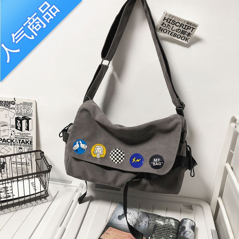 封后斜挎包男潮牌2022新款日系男学生背包大容量帆布邮差包休闲单肩包单肩包男