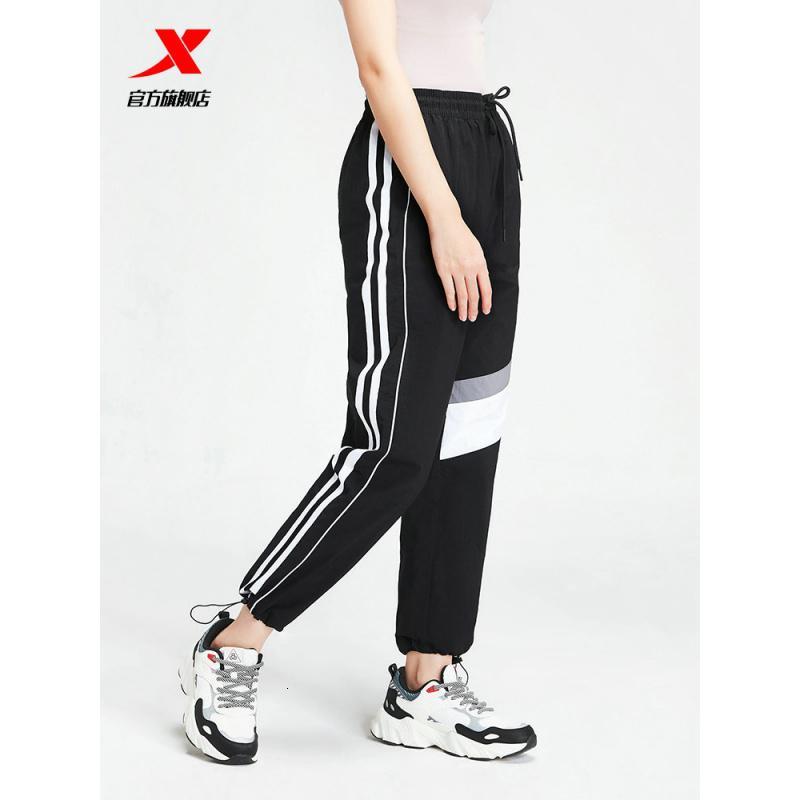 特步女裤运动服春秋新款运动裤女休闲小脚九分裤宽松女子梭织长裤