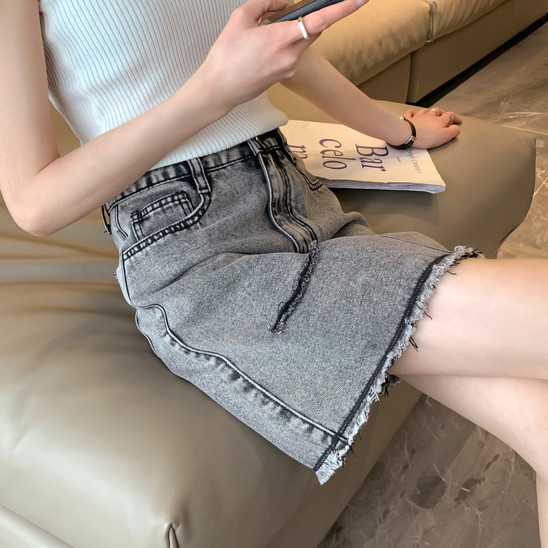 [2.5折价49元]唐狮半身裙女春新款显瘦百搭破洞毛边牛仔短裙小个子a字裙