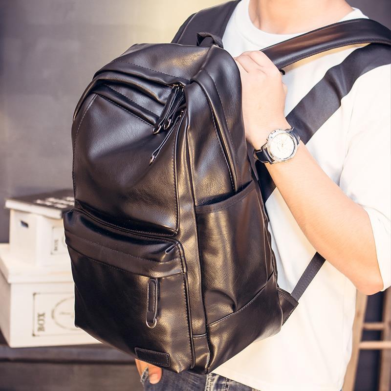 双肩包学生书包韩版潮包背包书包电脑包旅行包双肩包男皮书包铆钉款式