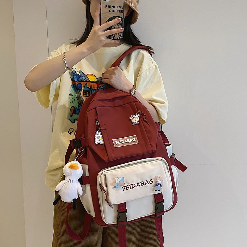2021年新款书包女高中大学生夏天日系初中大容量双肩包小学生背包 黑色送鸭子挂件和徽章