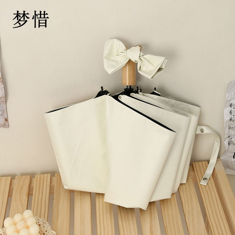 梦惜 手动钢骨玻纤 加厚黑胶布 实木手柄 晴雨两用伞 YF-S2021003/把高清大图