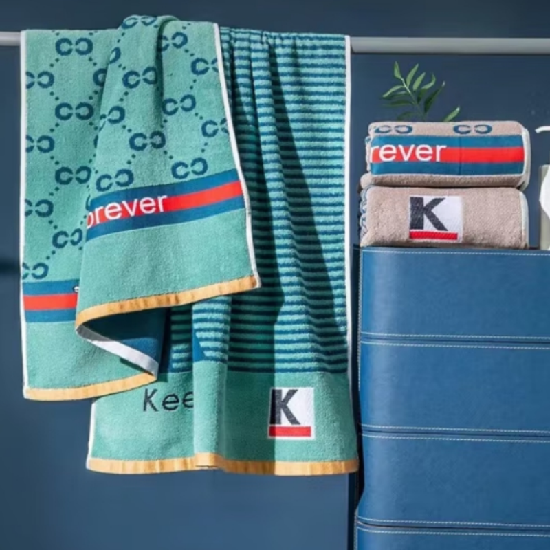 世纪金鹰 32股纱全棉提花断档浴巾 450克*1 条高清大图