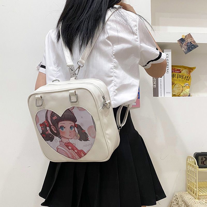透明痛包双肩斜挎包包女新款学生日系PU吧唧包2021jk包制服包单肩 爱心粉色[普通面料+小号斜跨] 单包