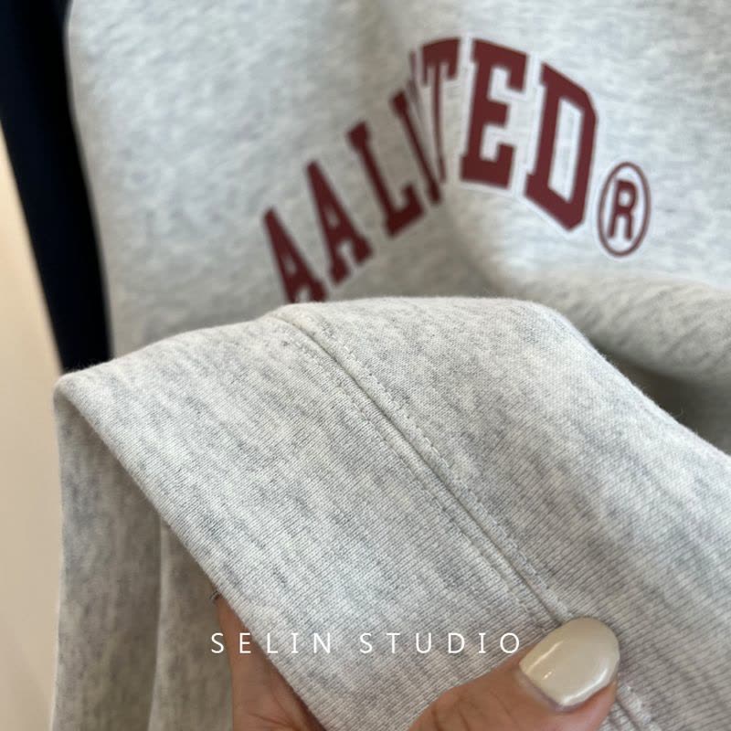 薄款卫衣女圆领字母印花拼接 后包条莎丞图片