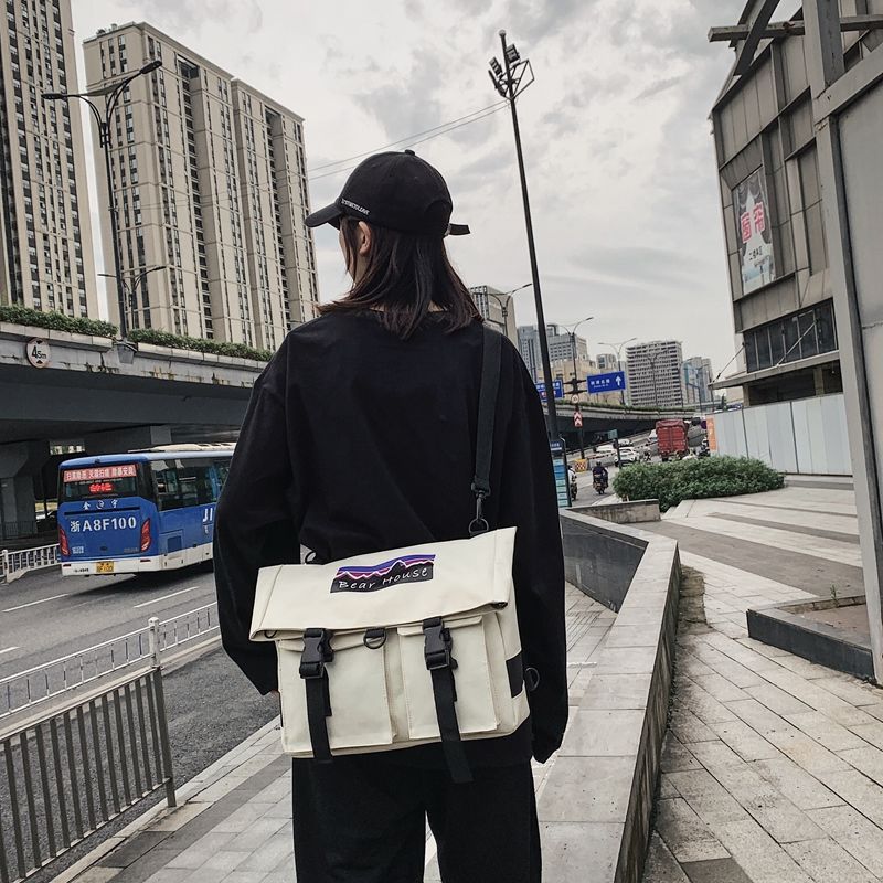 多功能书包女可爱学生韩版双肩包学院风男女情侣款背包时尚潮流包 白色+黑色字母图案款