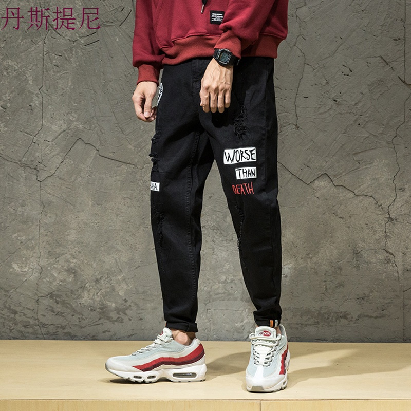 牛仔裤男生宽松大码青少年潮流休闲小脚哈伦裤个性印花秋季长裤子