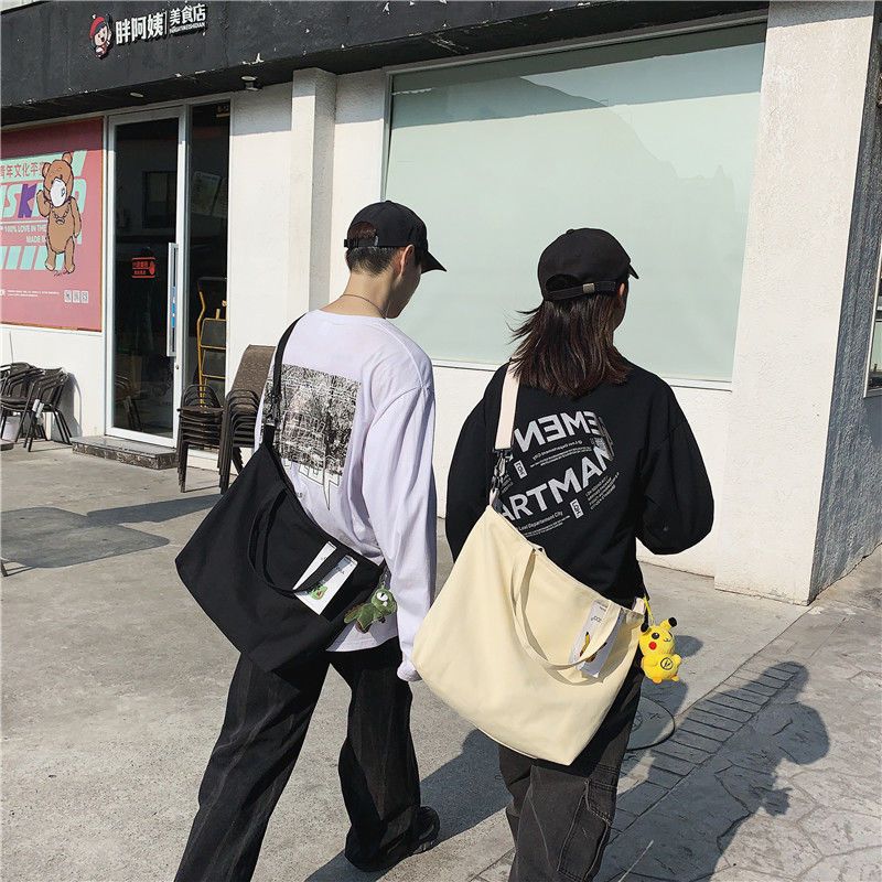 帆布包男斜挎包韩版包包男学生单肩包大容量原宿风手提背包女白搭 黑色蜕变(送小本加徽章)