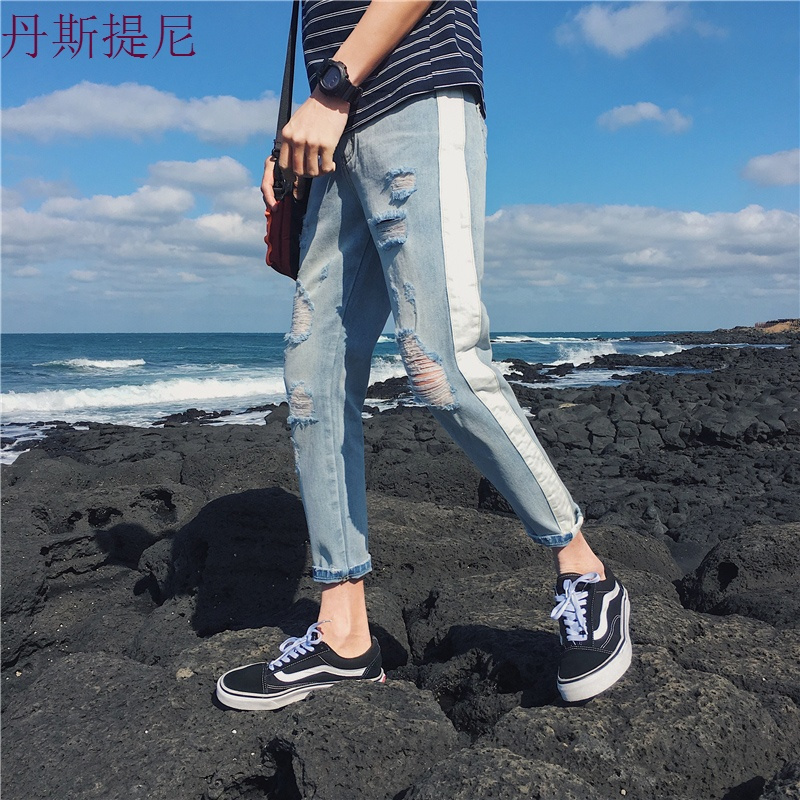 秋季新款牛仔裤男宽松大码小脚潮流哈伦裤日系学生复古破洞长裤子