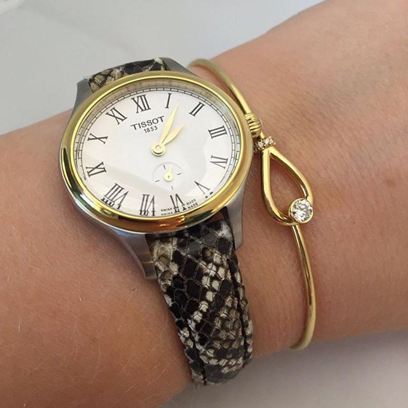 瑞士tissot天梭手表女臻时系列石英椭圆形时尚女表间金白盘皮带t