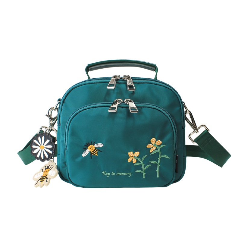 花间公主记忆之钥刺绣配挂饰女包包2021春季新款斜挎手提尼龙防水布包